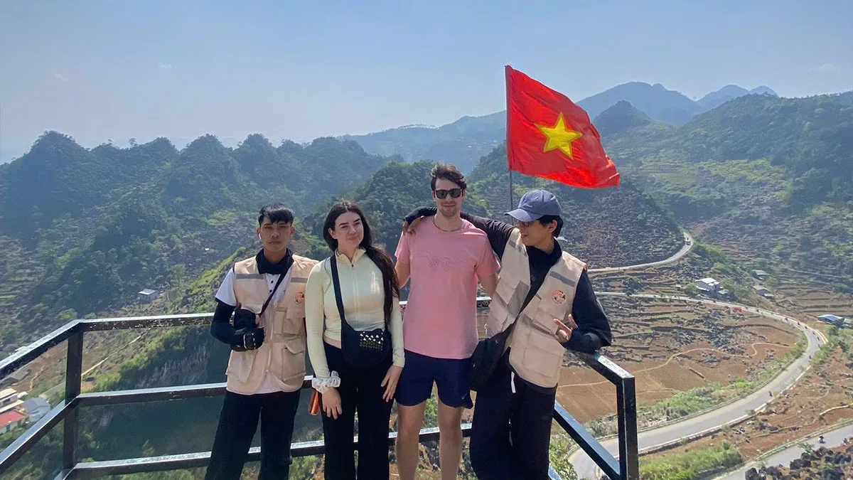 Travelers riding through changing weather in Ha Giang
